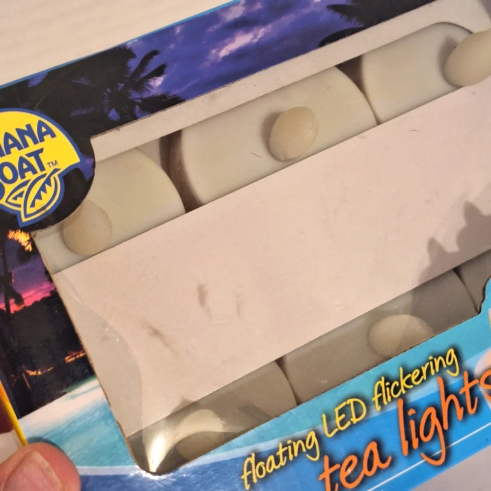 Banana Boat 6 Pack Floating LED Flickering Tea Light Candles Multicolor NIB